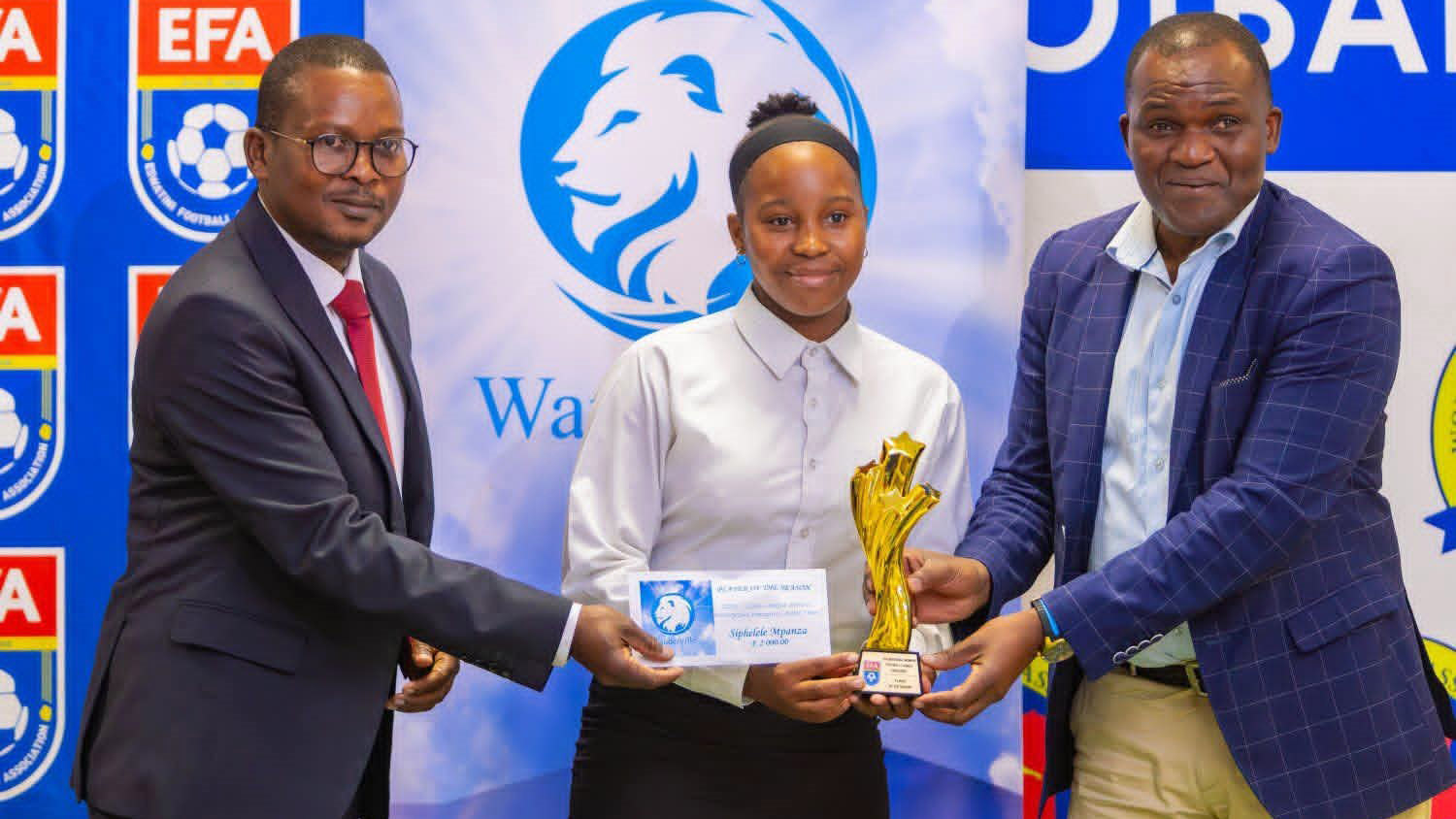 EWFL Player of the Season Siphelele Mpanza (C) receiving her trophy from EFA CEO Frederick Mngomezulu (R) and EWFA Chairman Bonginkhosi Mhlanga. (Pic: Nimrod Hlophe)